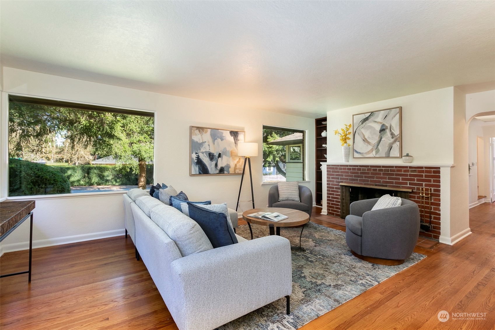 3203 Northeast 88th Street Seattle, WA 98115 - Photo 3 of 28 a living room with furniture and a fireplace