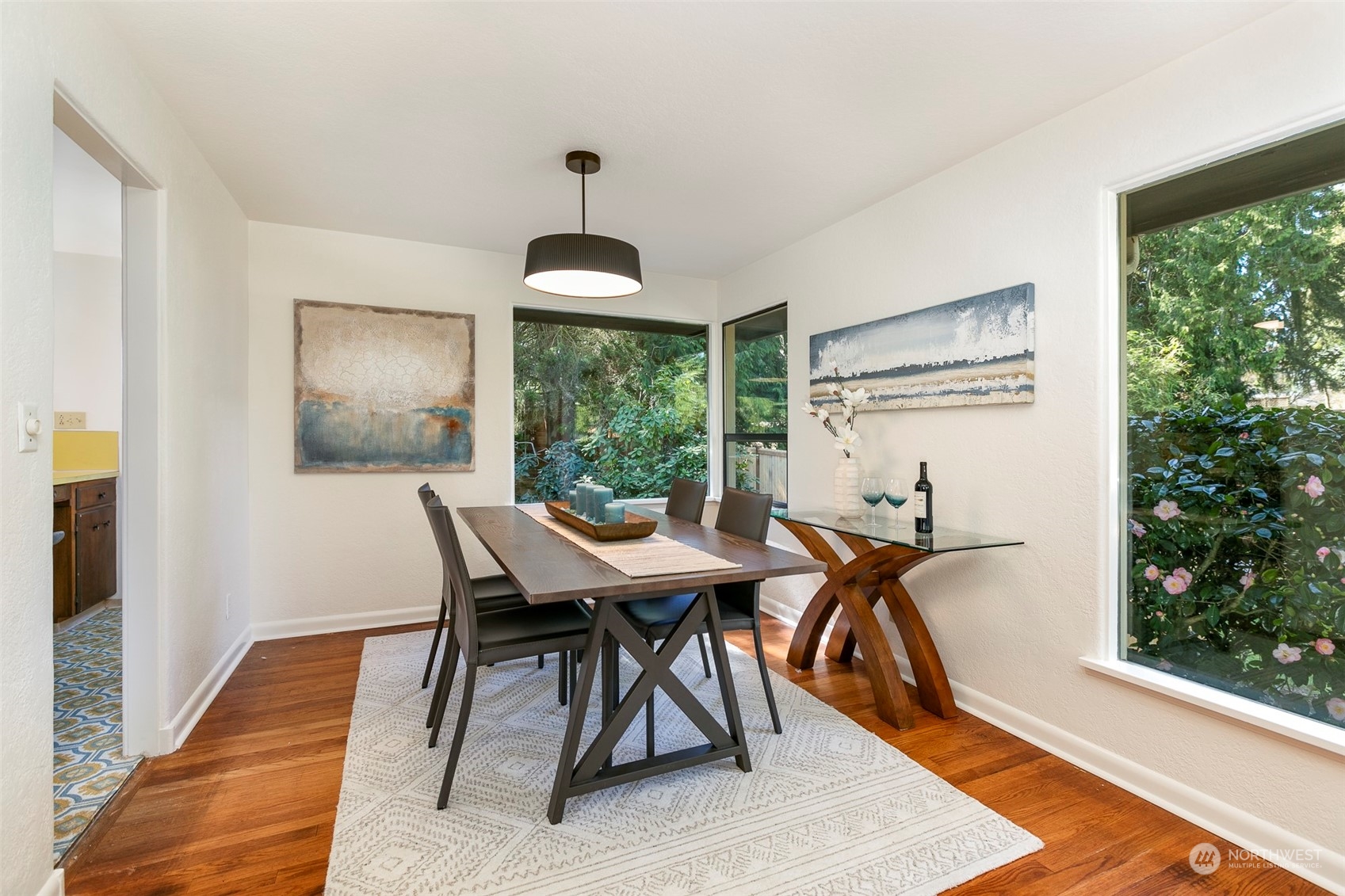 3203 Northeast 88th Street Seattle, WA 98115 - Photo 5 of 28 a view of a dining room with furniture window and wooden floor