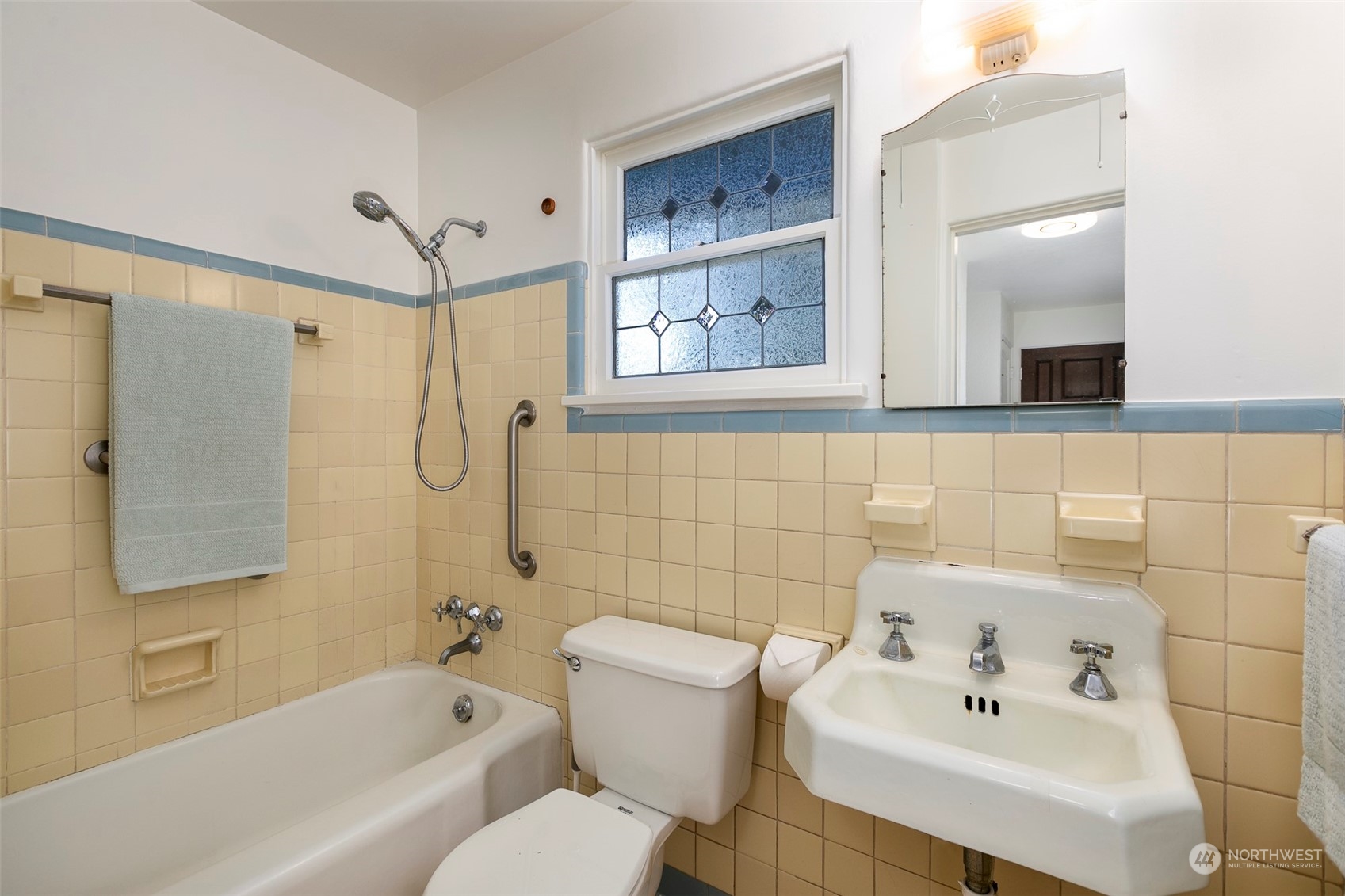 3203 Northeast 88th Street Seattle, WA 98115 - Photo 10 of 28 a bathroom with a sink toilet and shower
