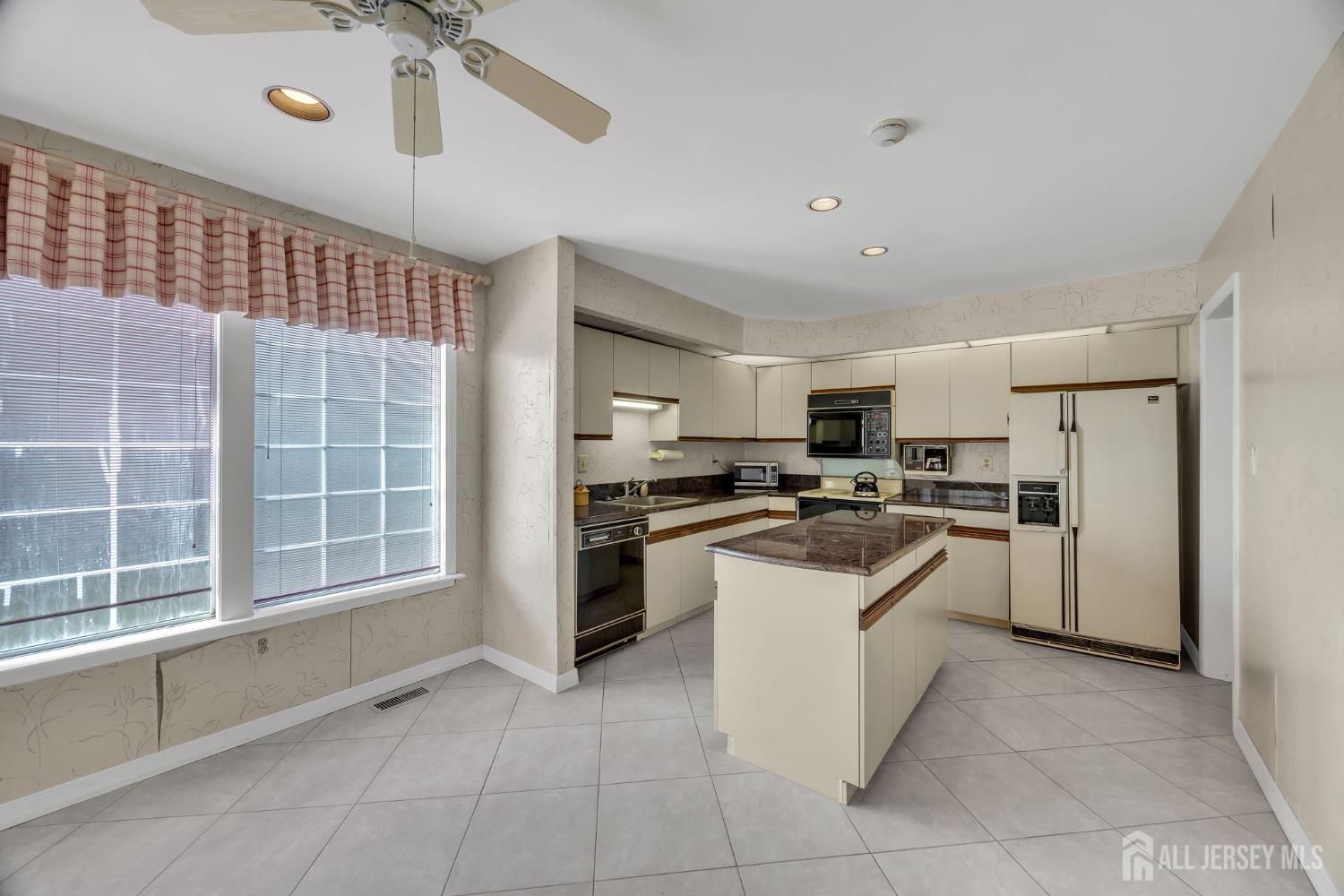 6 Winslow Road Monroe Township, NJ 08831 - Photo 16 of 33 a kitchen with cabinets and stainless steel appliances