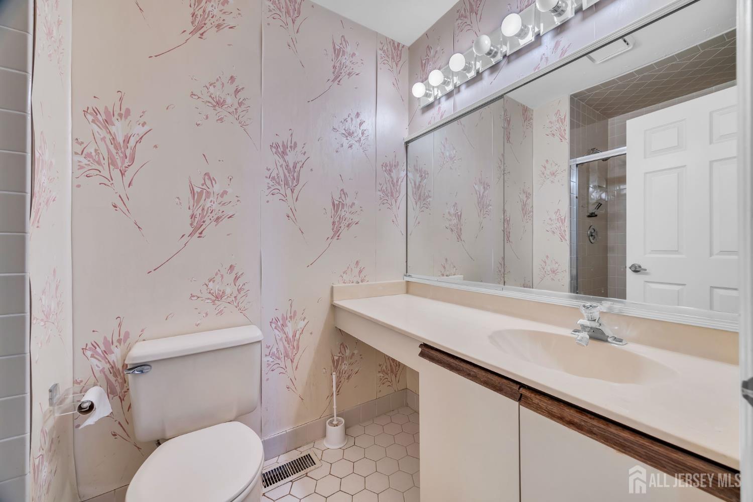 6 Winslow Road Monroe Township, NJ 08831 - Photo 17 of 33 a bathroom with a sink a toilet and shower