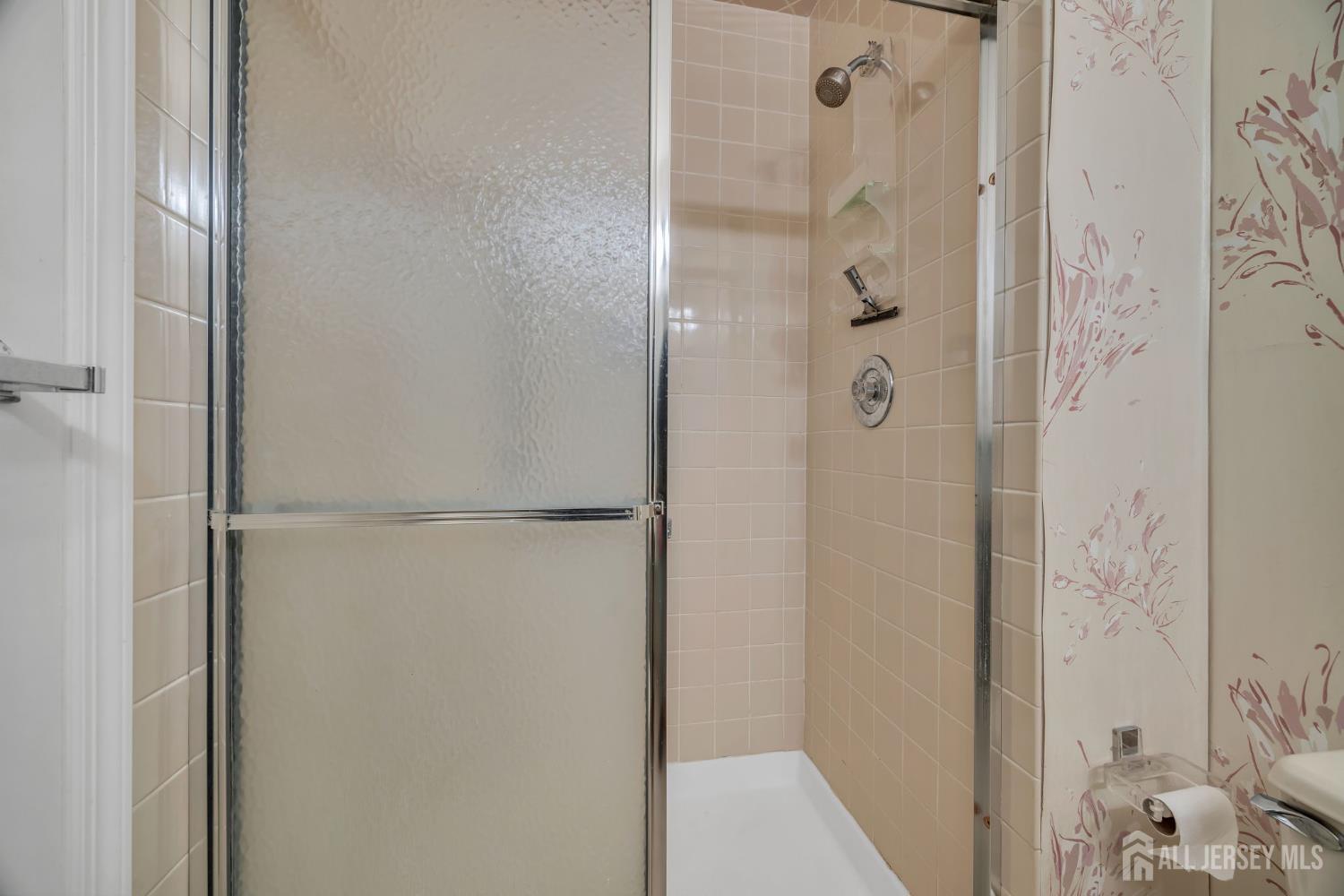 6 Winslow Road Monroe Township, NJ 08831 - Photo 18 of 33 a bathroom with a glass shower door