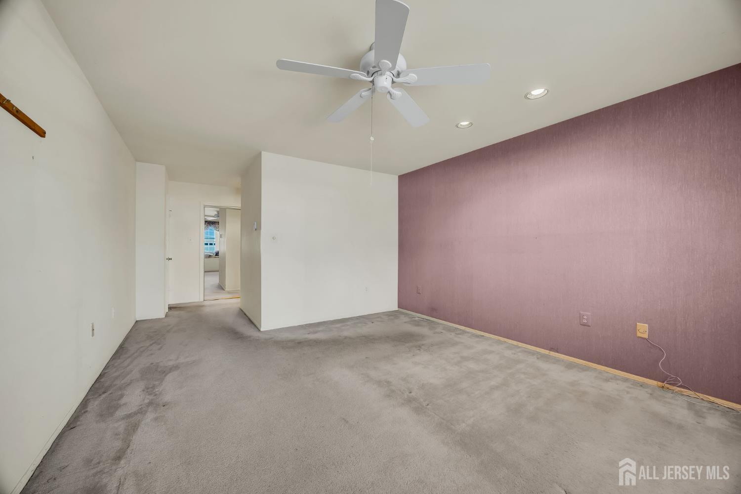 6 Winslow Road Monroe Township, NJ 08831 - Photo 27 of 33 an empty room with a ceiling fan and a window