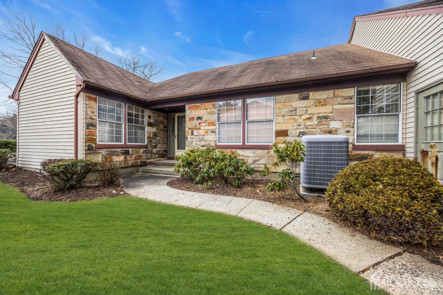 6 Winslow Road Monroe Township, NJ 08831 - Photo 3 of 33 a front view of a house with garden