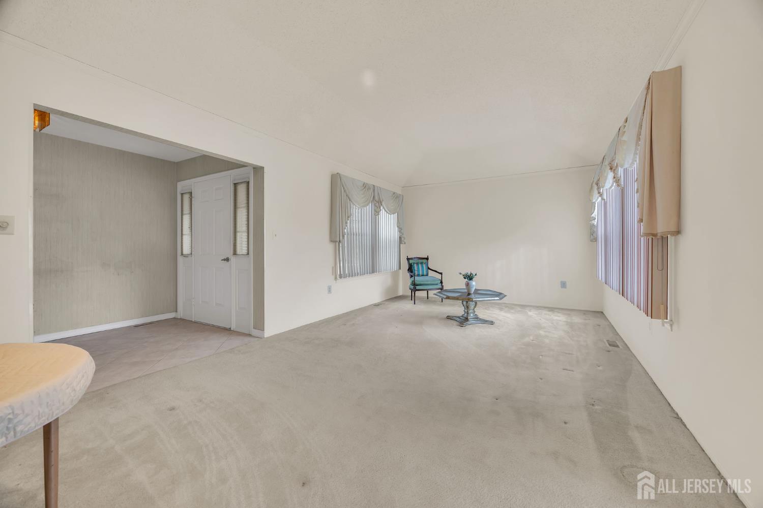 6 Winslow Road Monroe Township, NJ 08831 - Photo 8 of 33 a view of a livingroom with table and chair