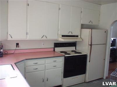 3034 Werner Road Nazareth, PA 18064 - Photo 8 of 11 a kitchen with a stove refrigerator and cabinets