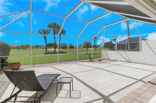 a view of backyard with seating area and barbeque oven