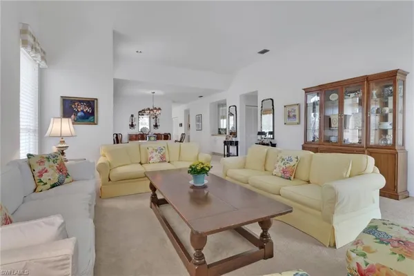 a living room with furniture and a table