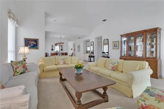 a living room with furniture and a table