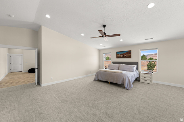 2591 East Washington Dam Road Washington, UT 84780 - Photo 22 of 67 Spacious bedroom featuring light-colored walls, recessed ceiling lighting, and a dark wood-finish ceiling fan