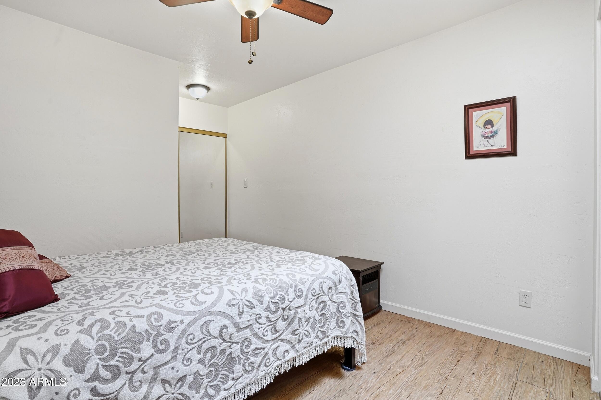 6334 East Albany Street Mesa, AZ 85205 - Photo 54 of 72 a bedroom with a bed and a dresser