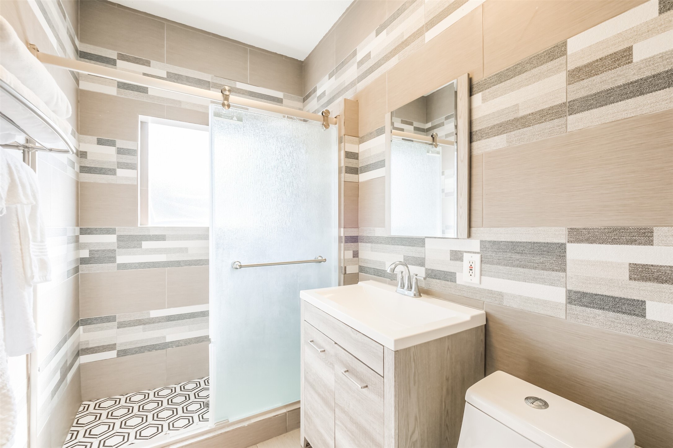 1716 Richmond Avenue, Unit 2 Houston, TX 77098 - Photo 14 of 21 a bathroom with a sink a toilet and a shower