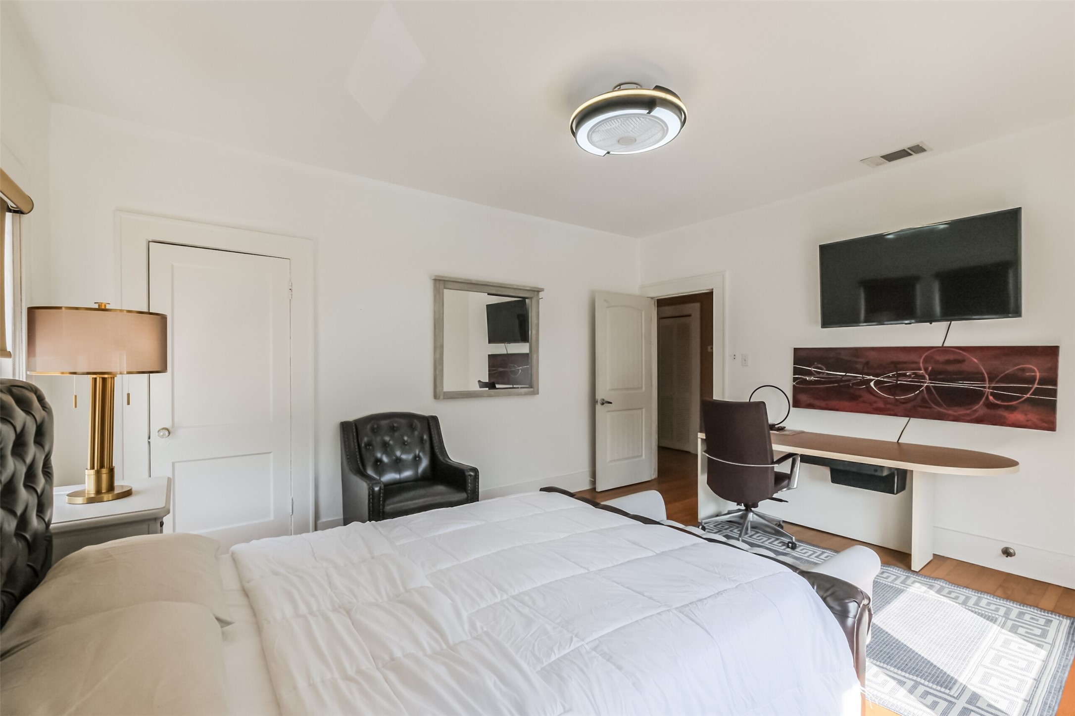 1716 Richmond Avenue, Unit 2 Houston, TX 77098 - Photo 16 of 21 a bedroom with a bed and a television