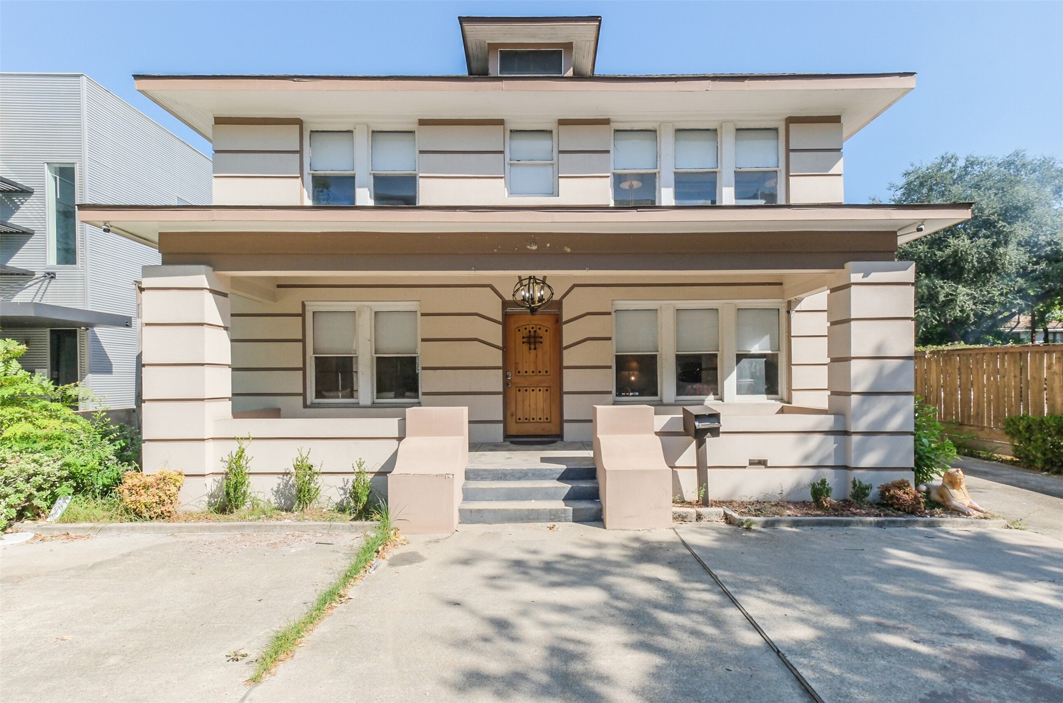 1716 Richmond Avenue, Unit 2 Houston, TX 77098 - Photo 21 of 21 front view of house with a bench and a large window
