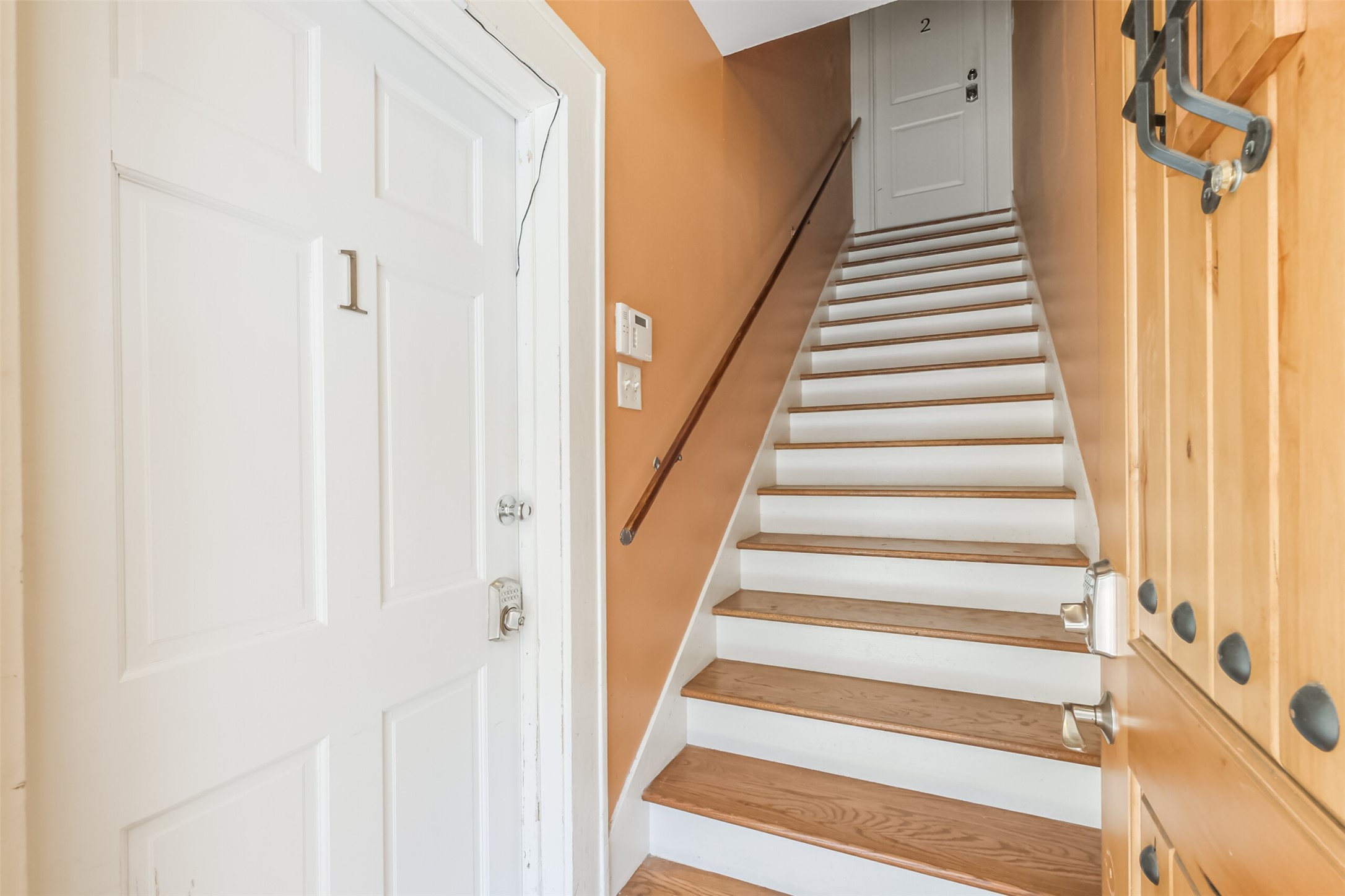 1716 Richmond Avenue, Unit 2 Houston, TX 77098 - Photo 5 of 21 a view of staircase with railing and white walls