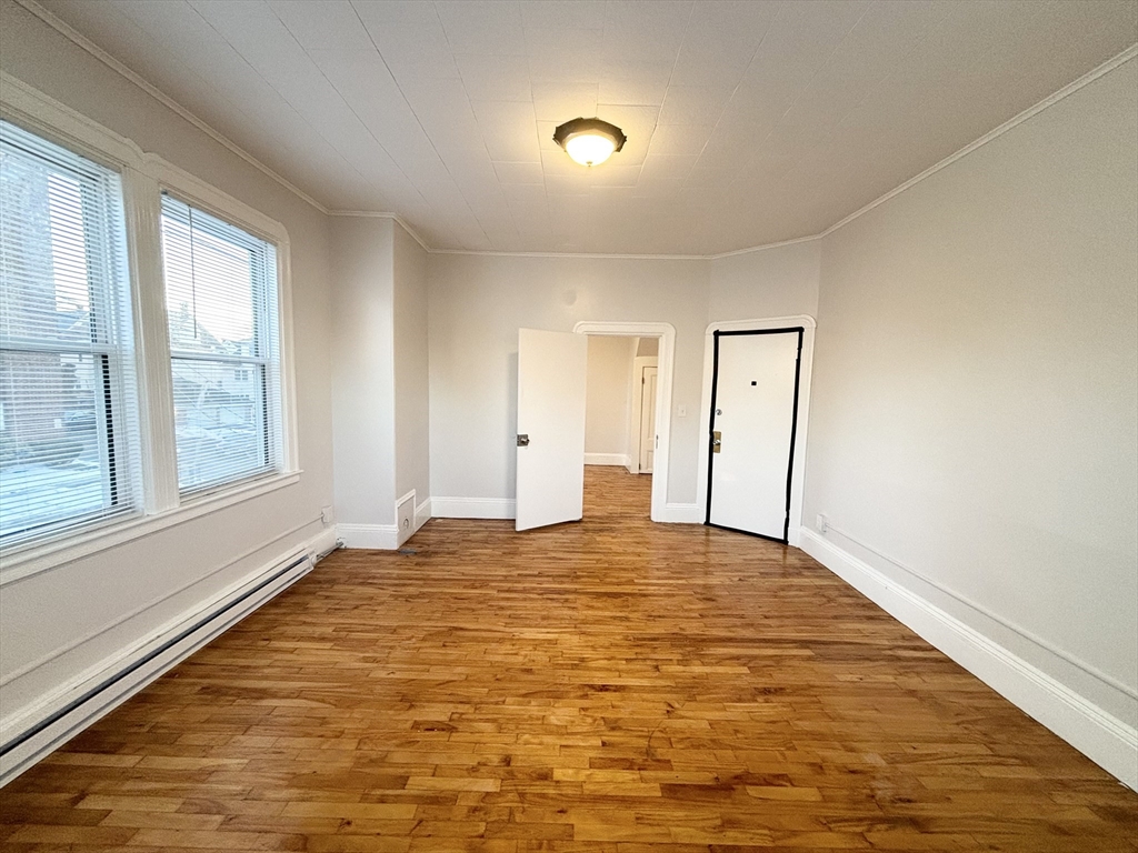 92 Main Street, Unit 1 Malden, MA 02148 - Photo 2 of 7 a view of an empty room and window