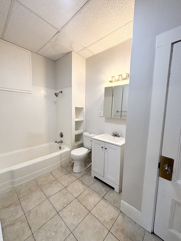 92 Main Street, Unit 1 Malden, MA 02148 - Photo 7 of 7 a bathroom with a sink a toilet and bathtub