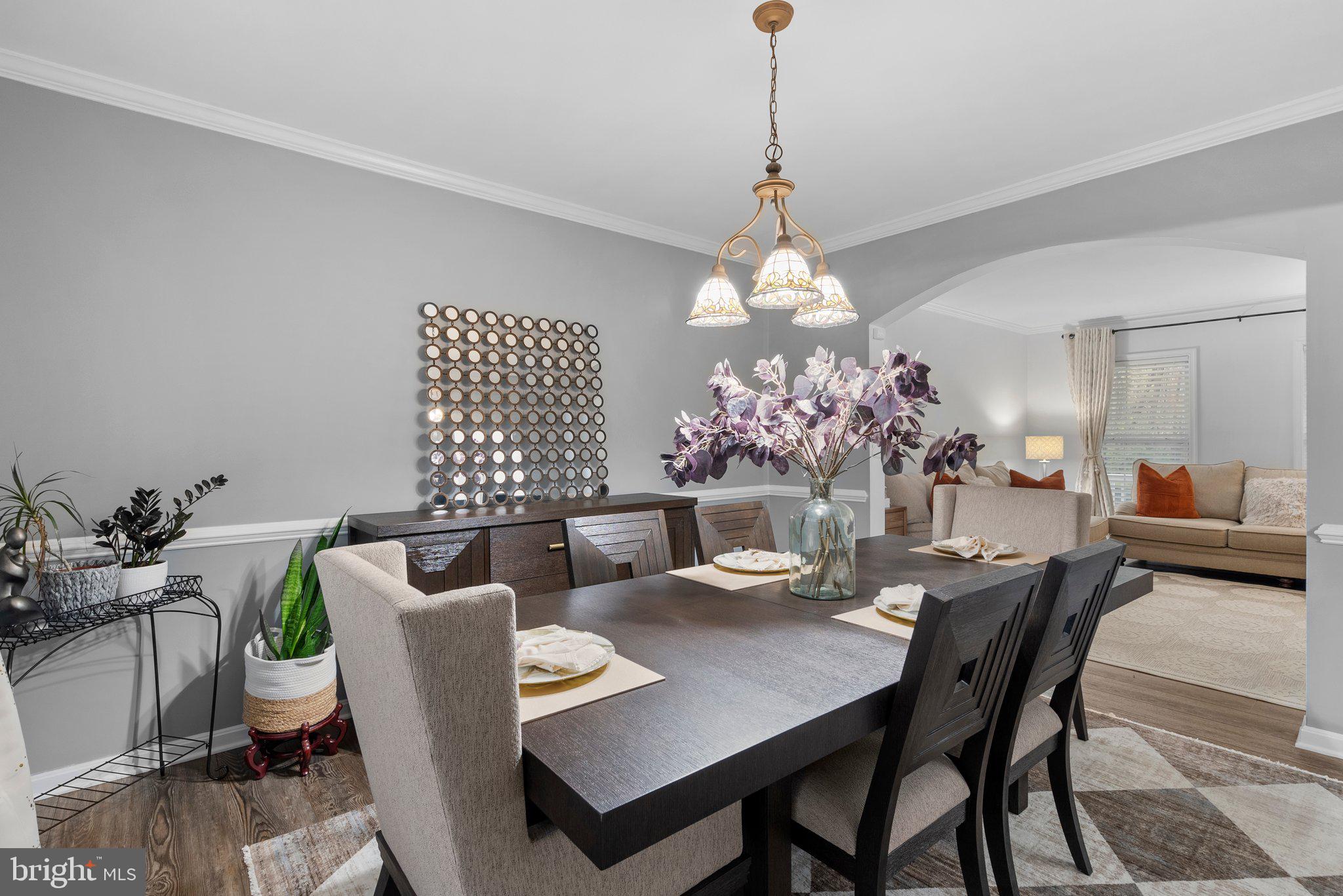 6355 Grant Chapman Drive La Plata, MD 20646 - Photo 12 of 57 a dining room with furniture a chandelier and window