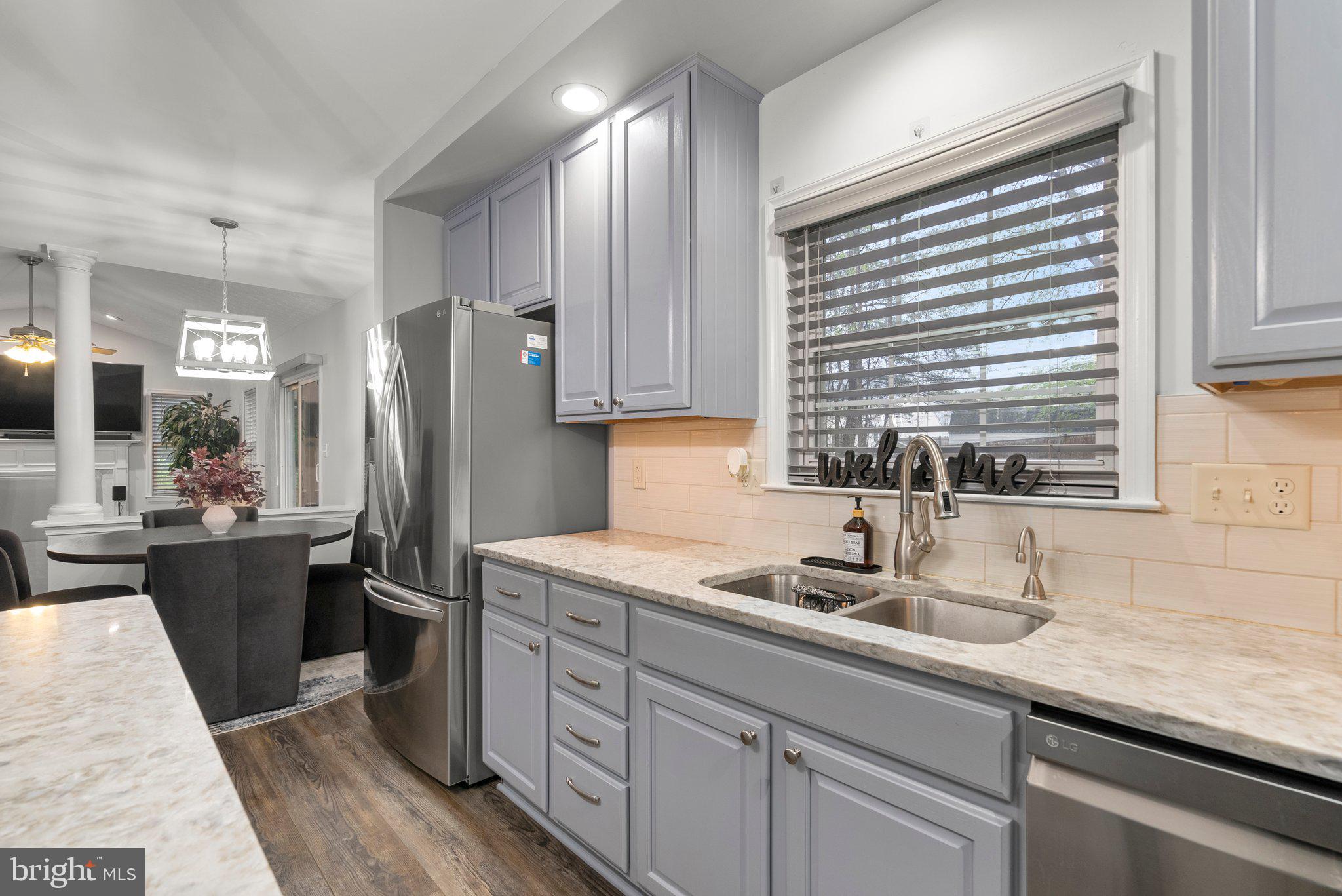 6355 Grant Chapman Drive La Plata, MD 20646 - Photo 18 of 57 a kitchen with stainless steel appliances granite countertop a sink stove and refrigerator