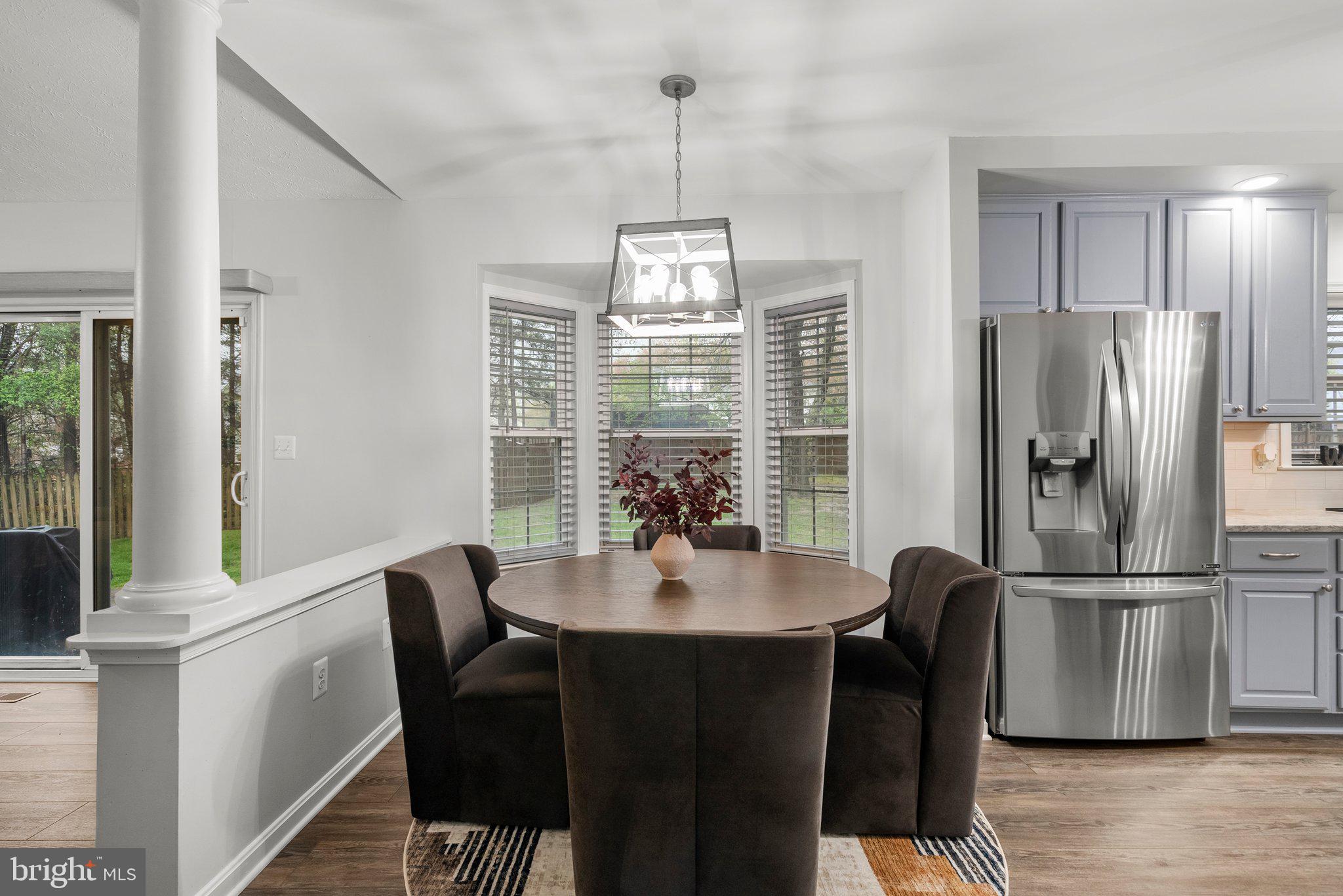 6355 Grant Chapman Drive La Plata, MD 20646 - Photo 20 of 57 a view of a dining room with furniture window and wooden floor