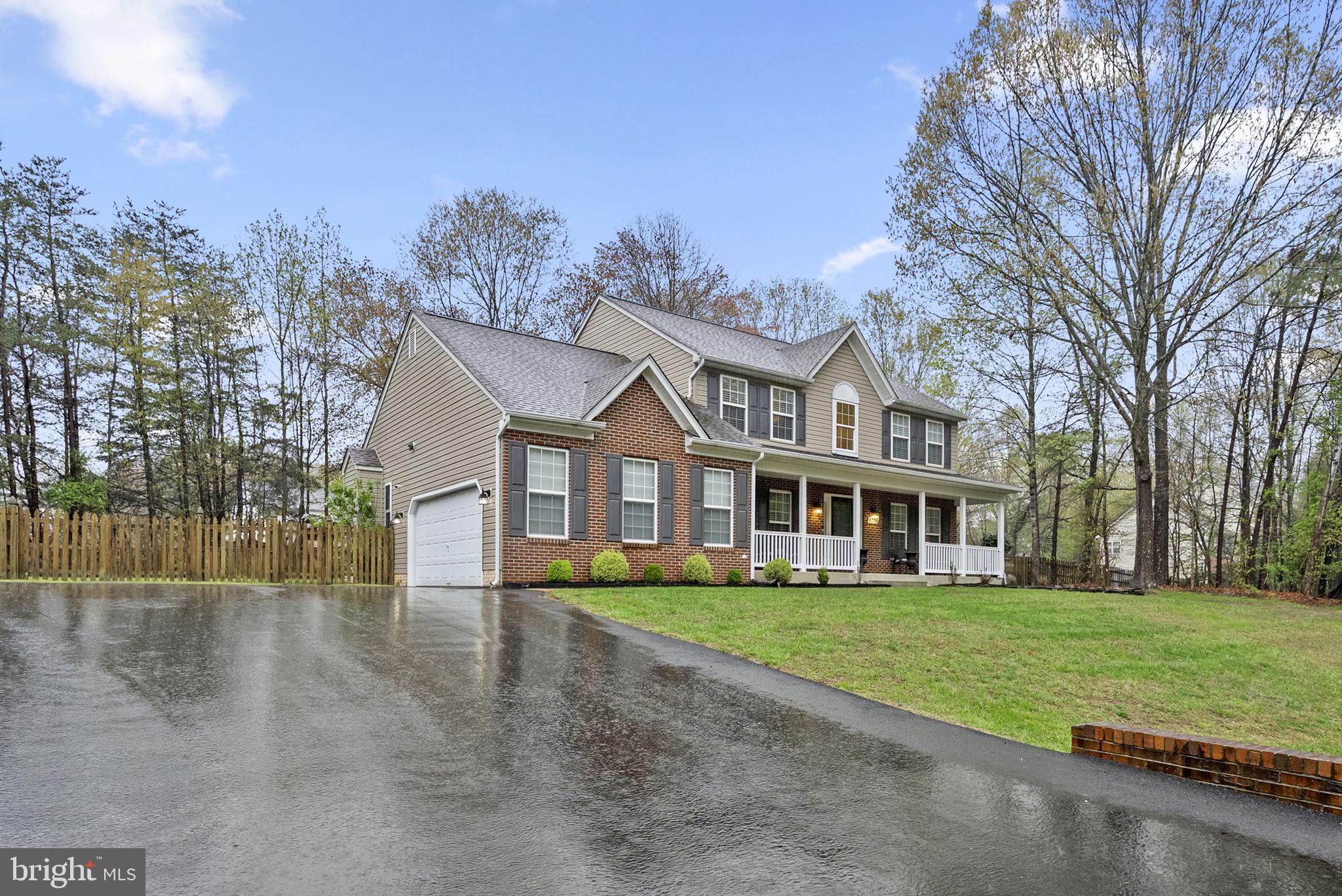 6355 Grant Chapman Drive La Plata, MD 20646 - Photo 2 of 57 a front view of a house with a yard and trees