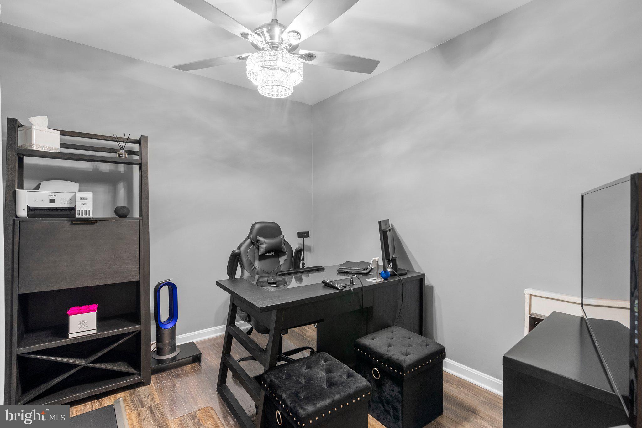 6355 Grant Chapman Drive La Plata, MD 20646 - Photo 26 of 57 a living room with furniture and a flat screen tv