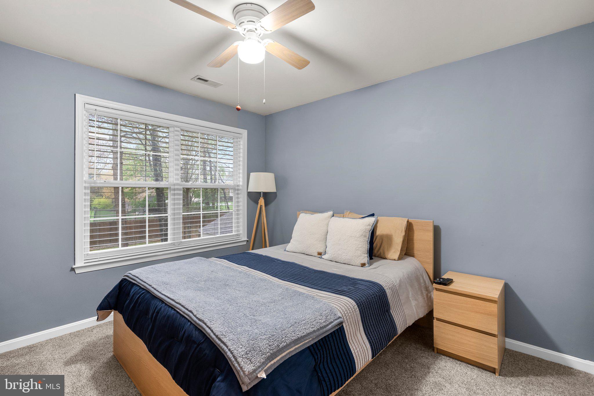6355 Grant Chapman Drive La Plata, MD 20646 - Photo 30 of 57 a bed sitting in a bedroom next to a window