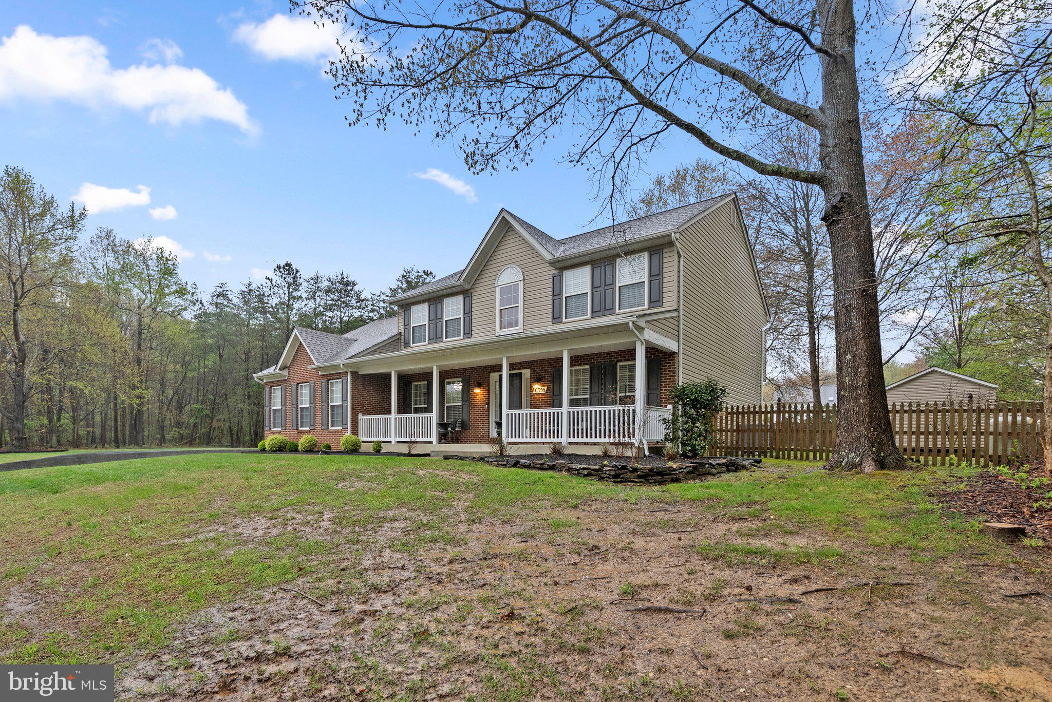 6355 Grant Chapman Drive La Plata, MD 20646 - Photo 3 of 57 a front view of a house with a garden