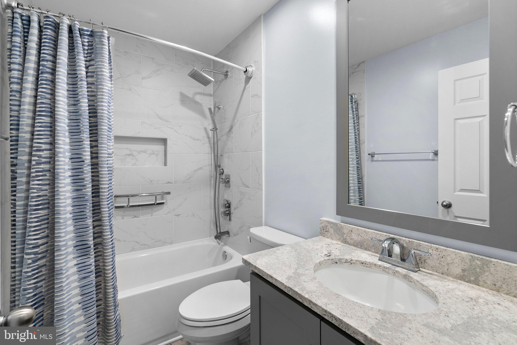 6355 Grant Chapman Drive La Plata, MD 20646 - Photo 33 of 57 a bathroom with a granite countertop sink toilet and shower