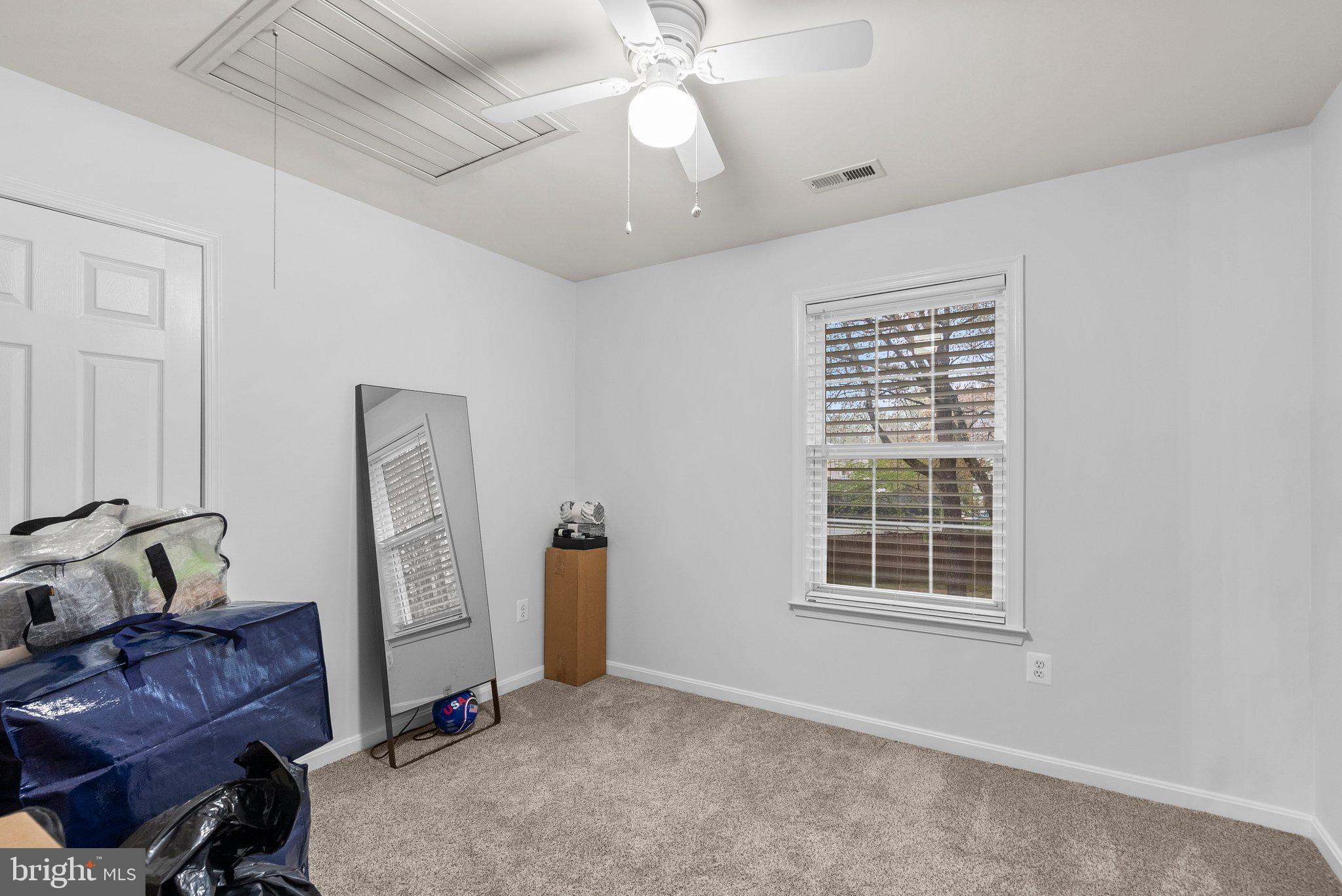 6355 Grant Chapman Drive La Plata, MD 20646 - Photo 38 of 57 a living room with furniture and a window