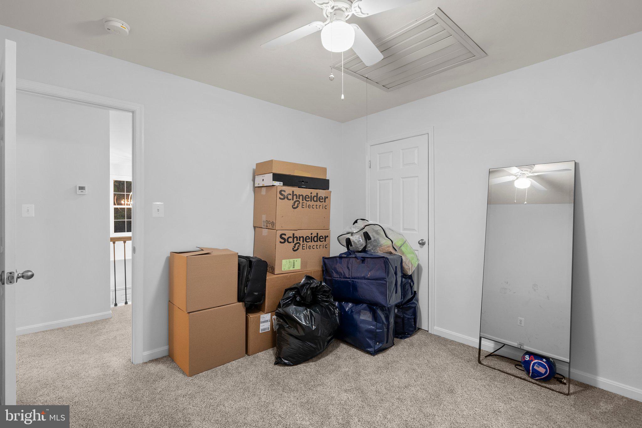 6355 Grant Chapman Drive La Plata, MD 20646 - Photo 39 of 57 a room with furniture and a chandelier fan