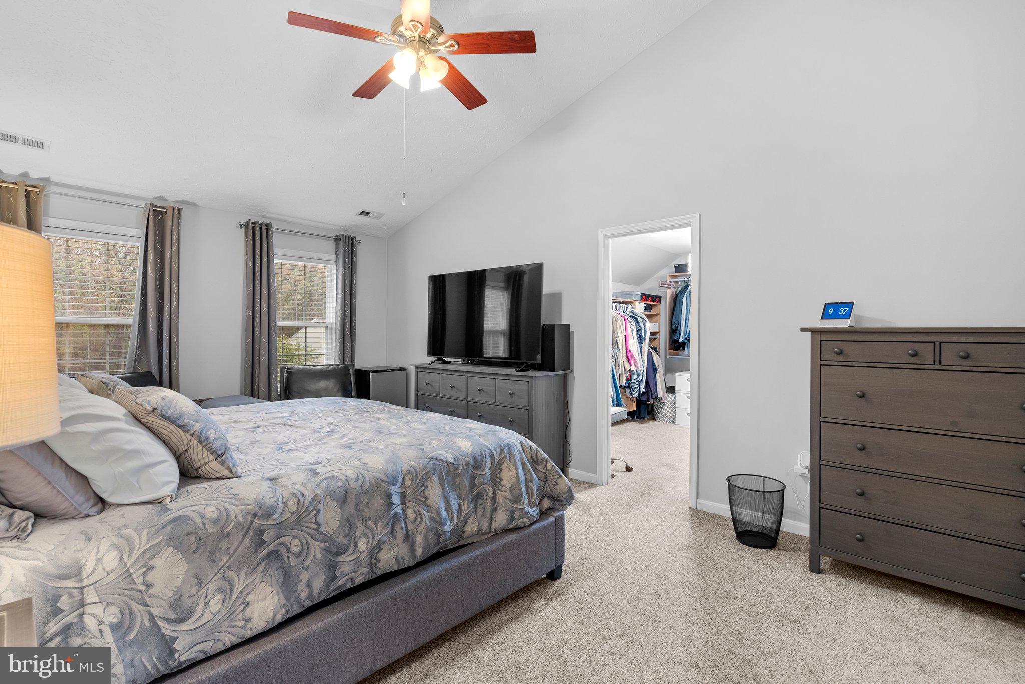 6355 Grant Chapman Drive La Plata, MD 20646 - Photo 40 of 57 a bedroom with a large bed and a flat tv screen on dresser