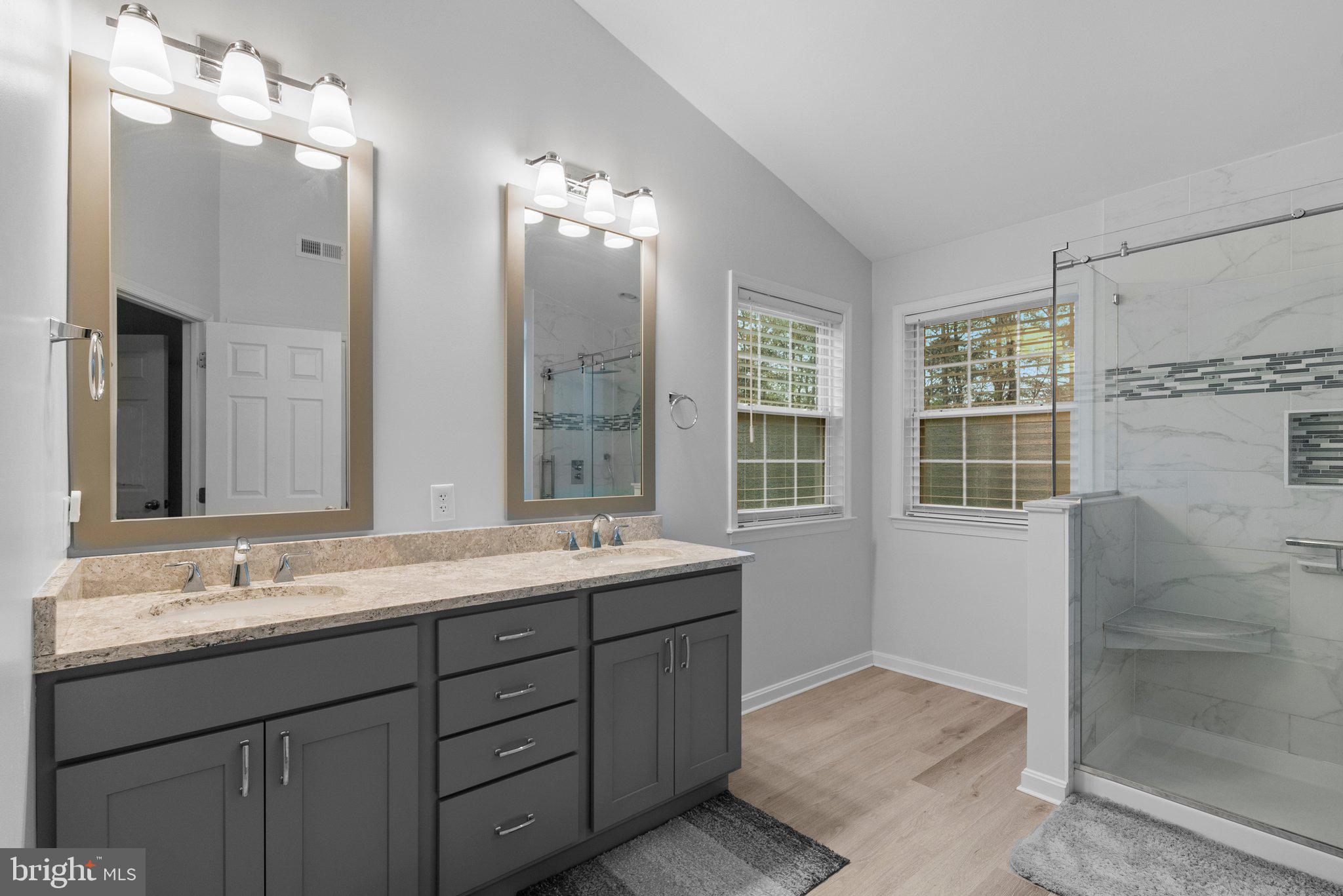 6355 Grant Chapman Drive La Plata, MD 20646 - Photo 45 of 57 a bathroom with double vanity sink and a mirror