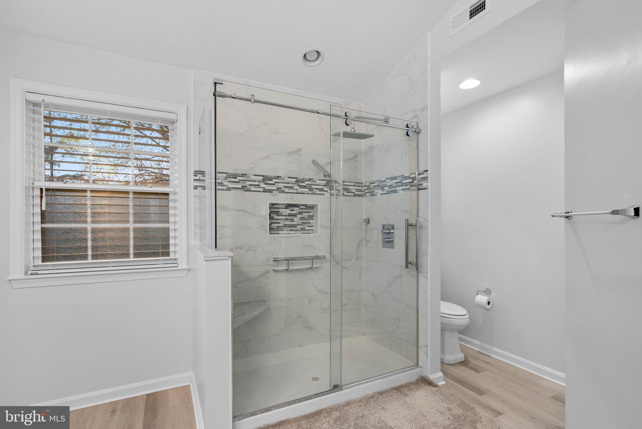 6355 Grant Chapman Drive La Plata, MD 20646 - Photo 46 of 57 a bathroom with a glass shower door