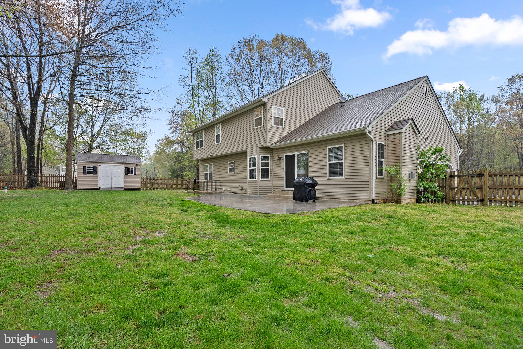 6355 Grant Chapman Drive La Plata, MD 20646 - Photo 56 of 57 a view of a yard in front of a house with large tree