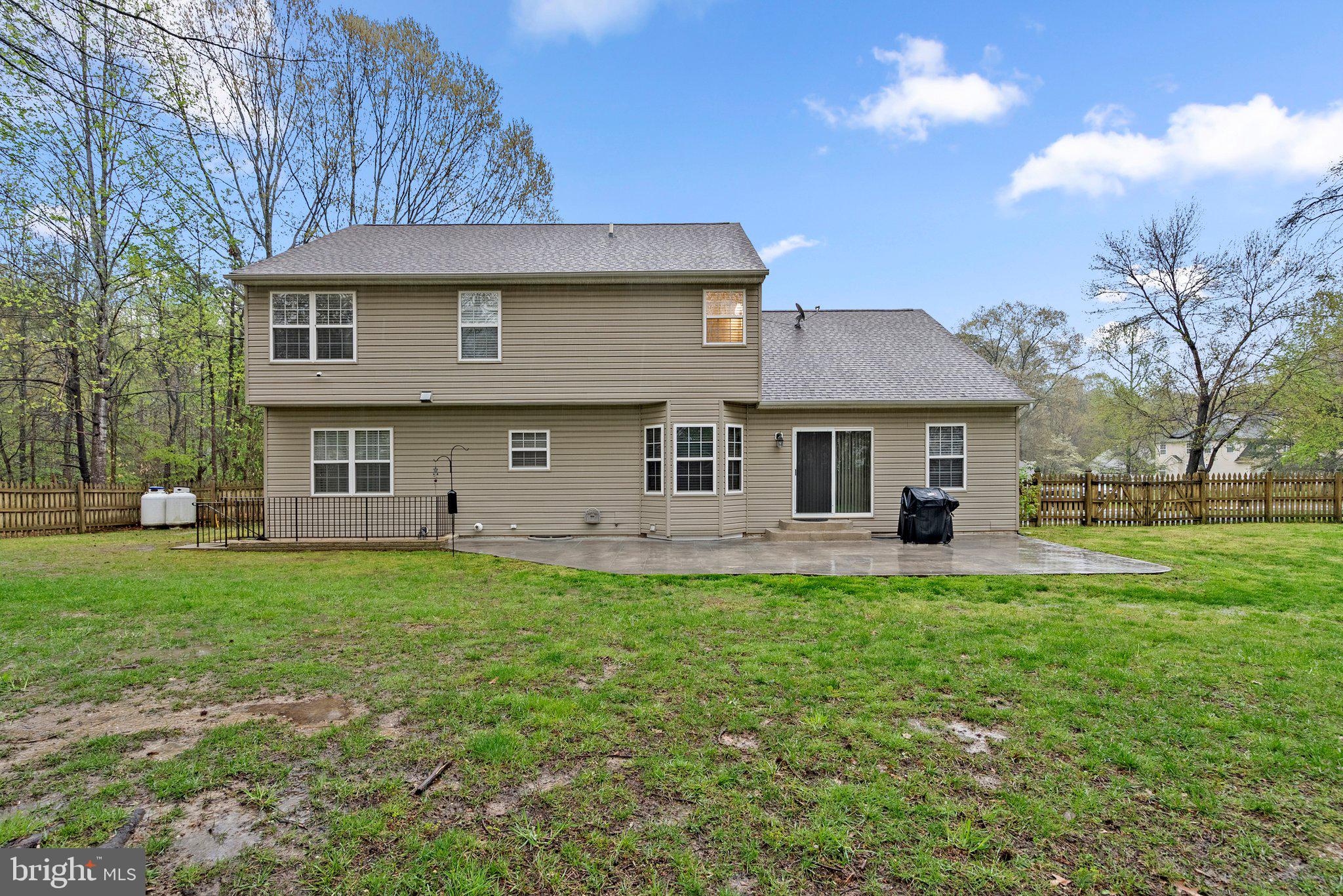 6355 Grant Chapman Drive La Plata, MD 20646 - Photo 57 of 57 a front view of a house with a garden and trees