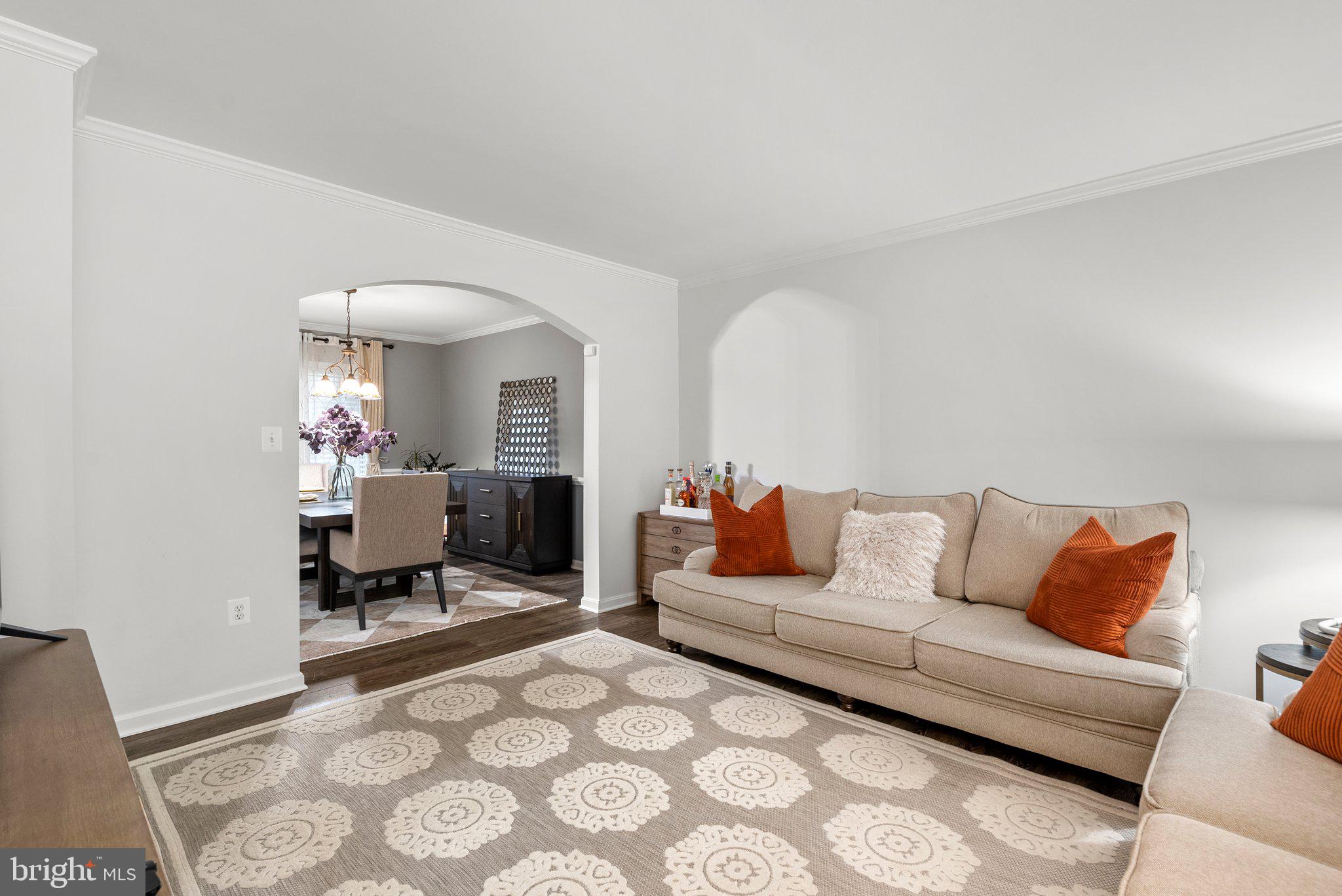 6355 Grant Chapman Drive La Plata, MD 20646 - Photo 7 of 57 a living room with furniture and a chandelier