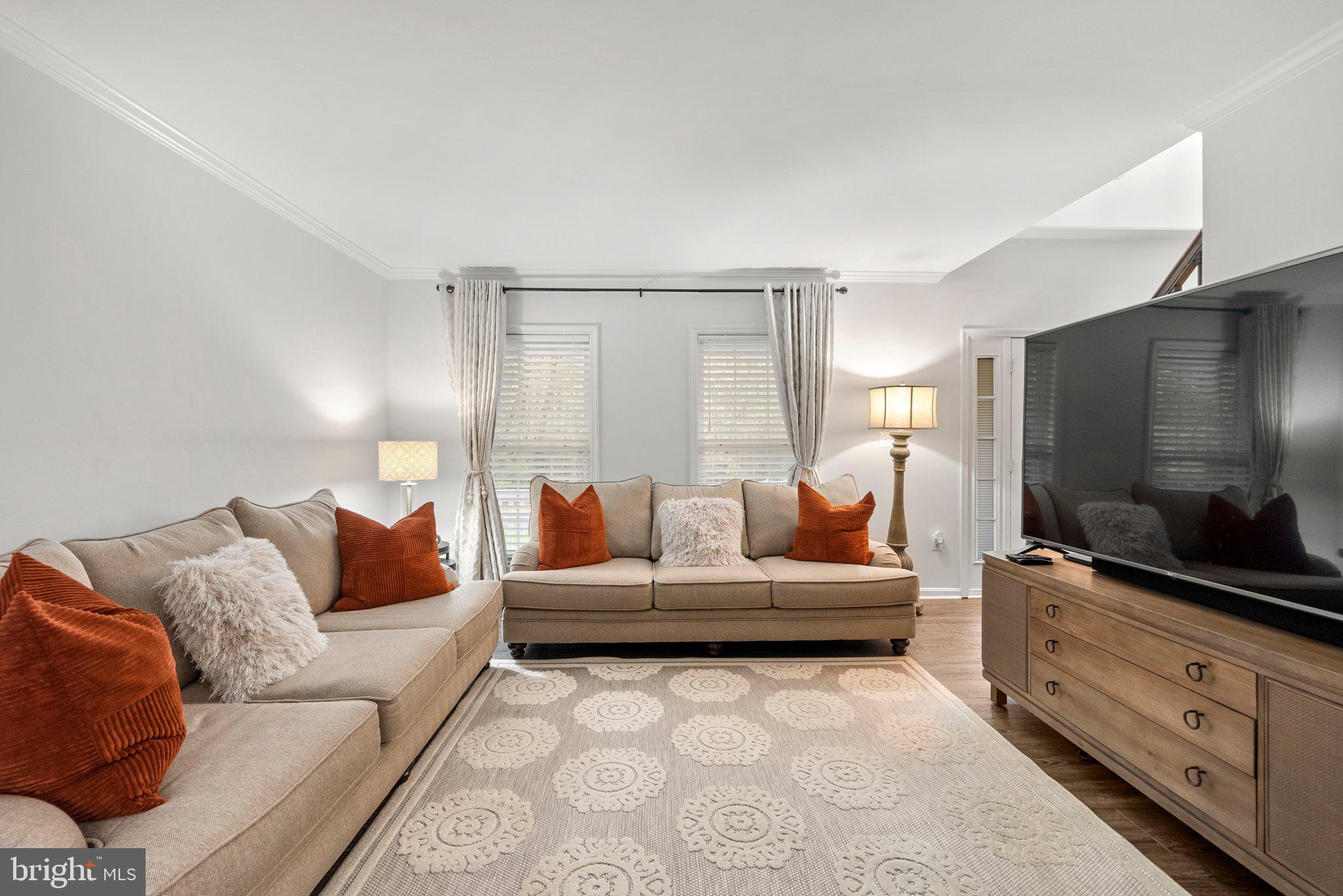 6355 Grant Chapman Drive La Plata, MD 20646 - Photo 8 of 57 a living room with furniture and a flat screen tv