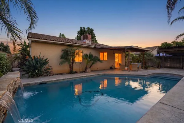 a view of a swimming pool with an outdoor seating