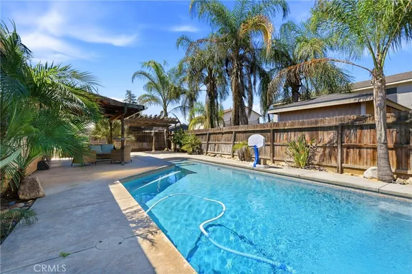a view of a swimming pool with a patio