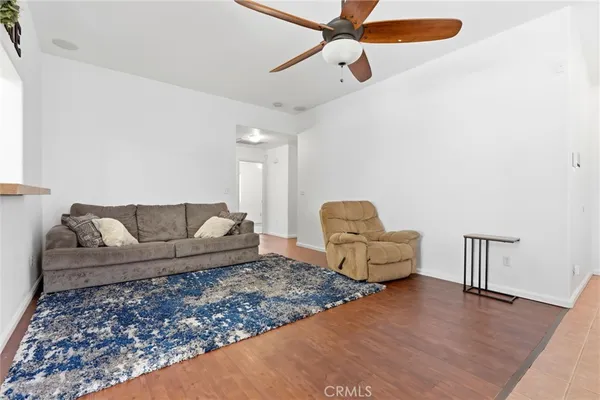a living room with furniture and a rug