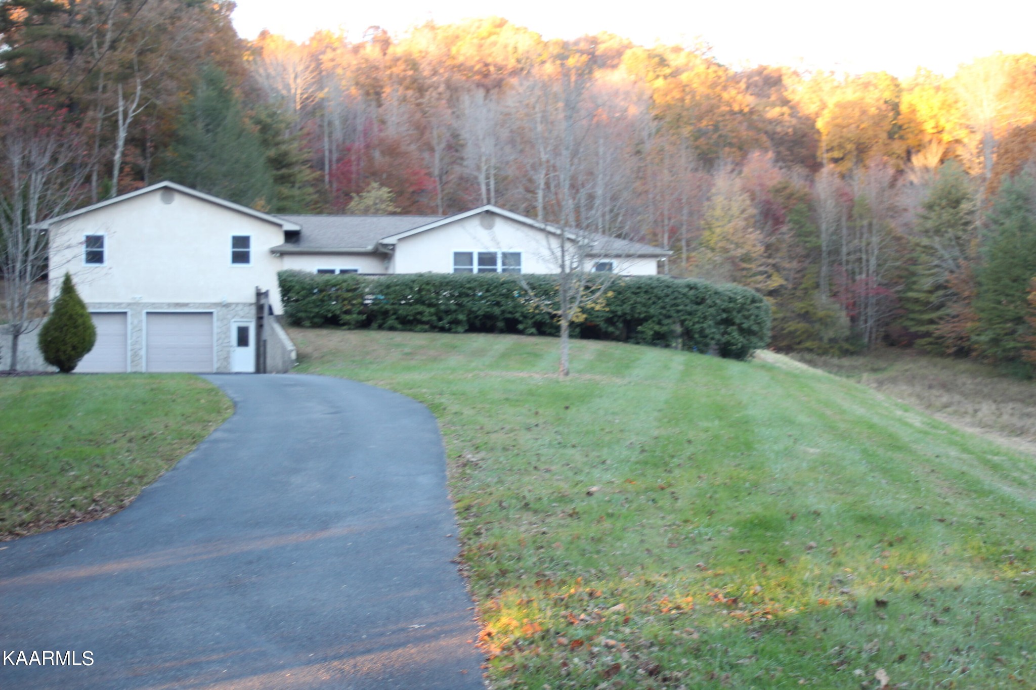 190 Dean Hill Road Oneida, TN 37841 - Photo 1 of 36 a front view of a house with a yard and garage
