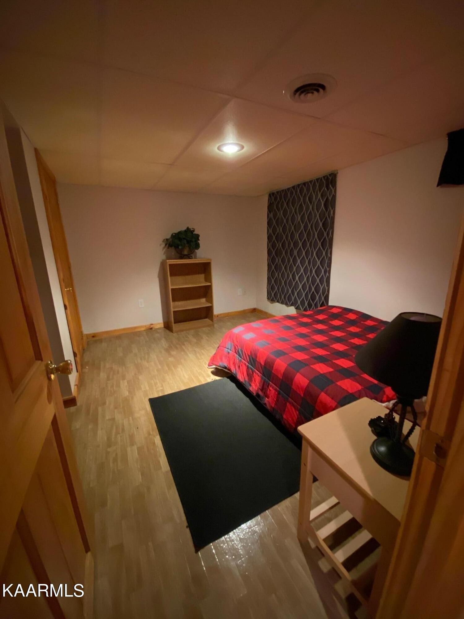 190 Dean Hill Road Oneida, TN 37841 - Photo 21 of 36 a bedroom with a bed and wooden floor