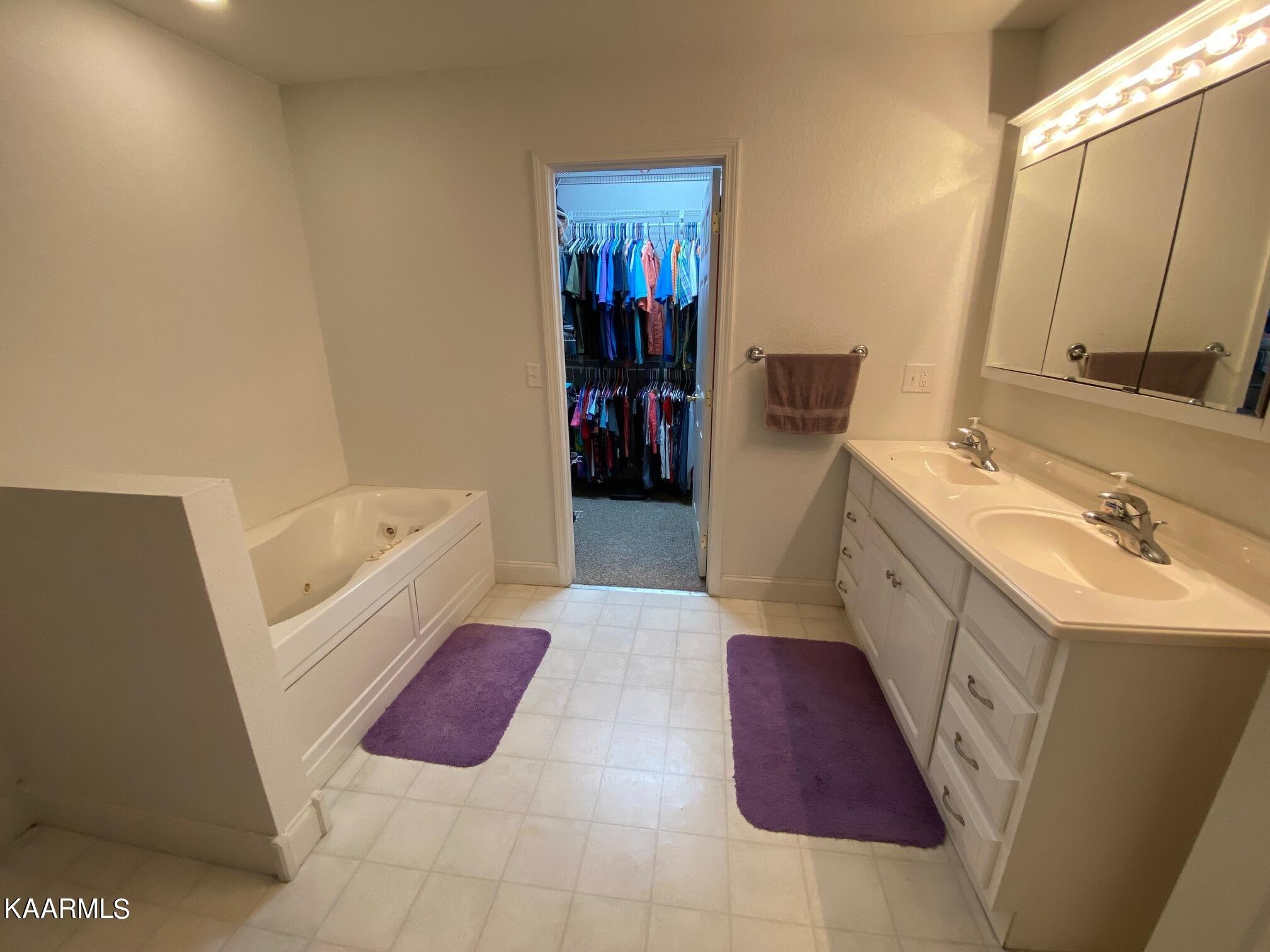 190 Dean Hill Road Oneida, TN 37841 - Photo 31 of 36 a bathroom with a tub sink and a mirror