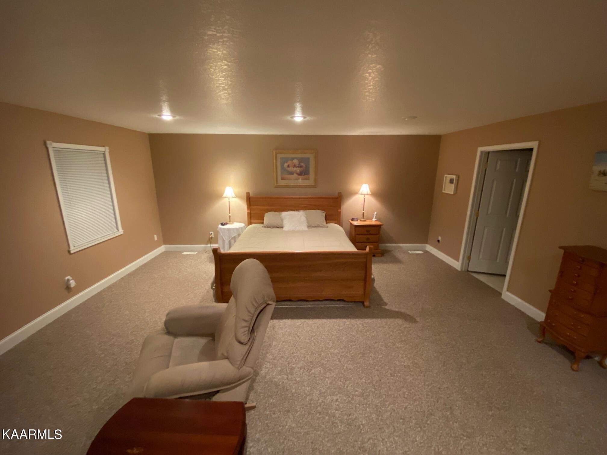 190 Dean Hill Road Oneida, TN 37841 - Photo 32 of 36 a spacious bedroom with a bed and a couch