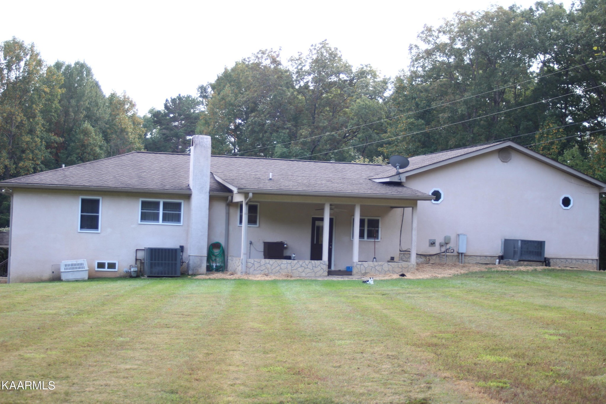 190 Dean Hill Road Oneida, TN 37841 - Photo 5 of 36 a view of a house with pool and yard