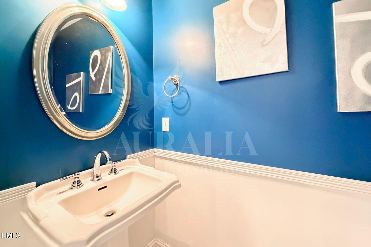 7754 ACC Boulevard Raleigh, NC 27617 - Photo 9 of 41 a bathroom with a sink and mirror