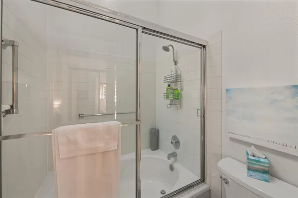 a bathroom with a shower and a tub