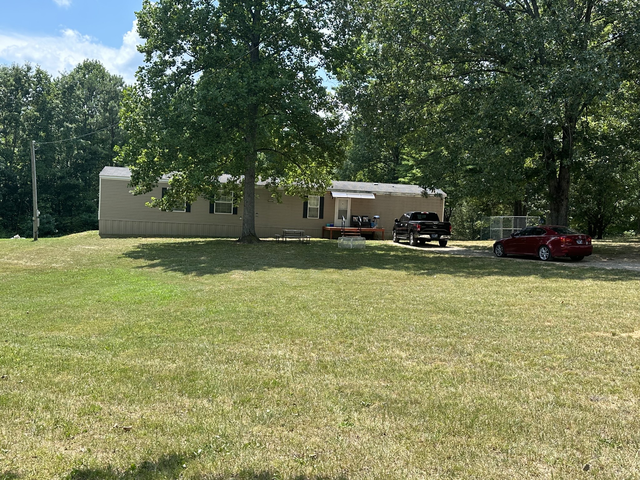 39 Kelly Road Leoma, TN 38468 - Photo 3 of 16 a backyard of a house with seating space