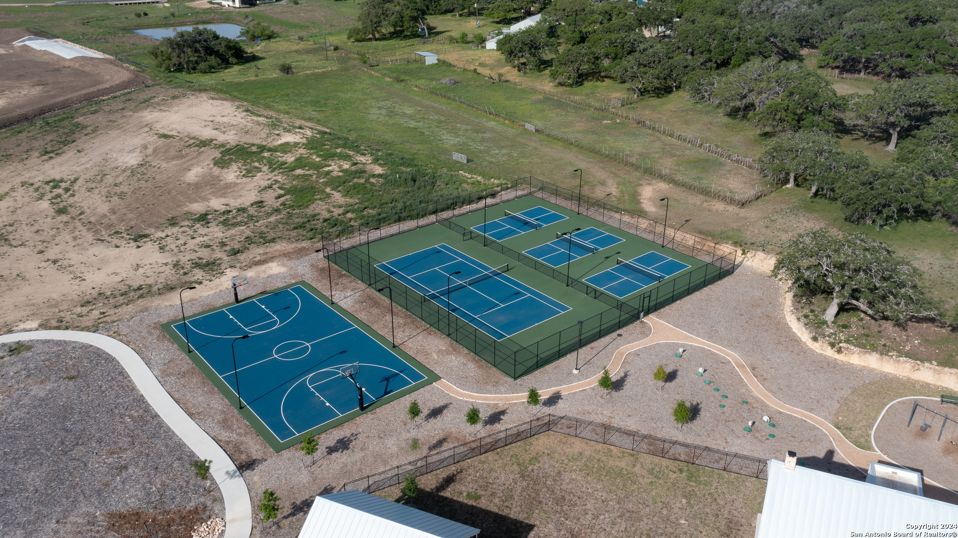739 Maximino Ridge Road Bulverde, TX 78163 - Photo 12 of 36 an aerial view of a residential houses with outdoor space